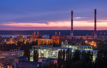 Big chemical factory at sunset