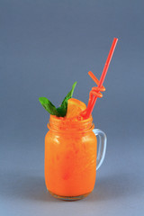 Colorful fruit cocktail on neutral background.