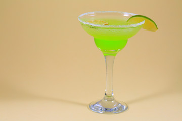 Colorful fruit cocktail on neutral background.