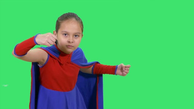 Superhero Girl In Fighting Stance On Green Screen