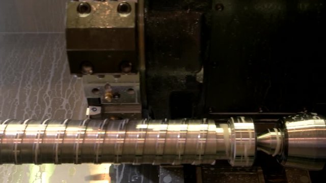 Closeup of lathe in action. Detail made of steel. New cnc machine.