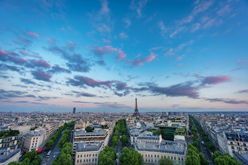 Skyline of Paris with Champs-Elysees and Eiffel tower at sunset