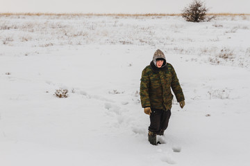 Fototapeta na wymiar Man in the winter steppe
