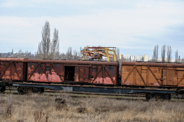 Naklejka premium Abandoned rusty railway containers for as and oil transportation
