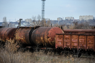 Abandoned rusty railway containers for as and oil transportation