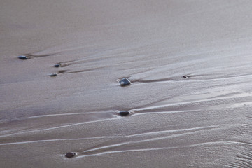 sand stones on sea waves movie blur