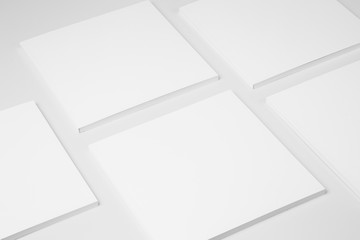 Real paperback white books on a gray background