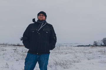 Fototapeta na wymiar traveler walking in a winter steppe