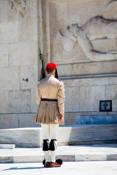 ATHENS, GREECE - JUNE 06, 2016: photo of evzone from the back  in front of the Tomb of the Unknown Soldier in Greece