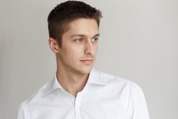 Portrait of a young man in a respectable white shirt