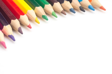 Colored pencils on a white background closeup
