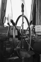 The ship's steering wheel with captain legs - black and white © neonnspb