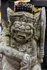 Stone sculpture on entrance door of the Temple in Bali