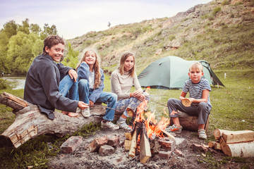 Children in the camp by the fire