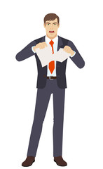Angry businessman tearing pape