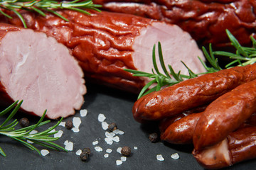 Set of cold cuts on a stone board. Mix of sausages