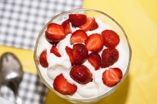 Cup With Sliced Strawberries And Whipped Cream