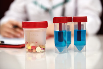 Blue Sample And Tablet On table