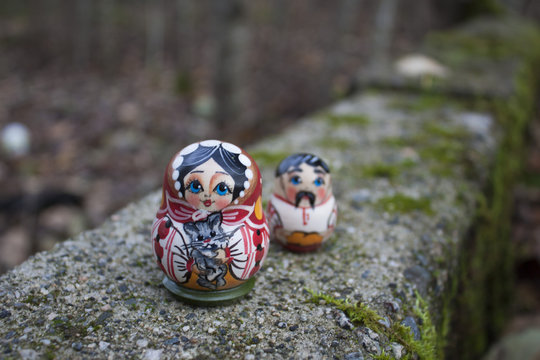Smiling Matroyshka Woman Standing in Front of Man