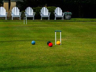 Croquet court with adirondack chairs on the lawn