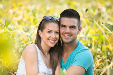 Fototapeta premium portrait of two young lovers in a field of soya beans