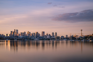 Morning light falls over Lake Union and the Seattle skyline with reflection