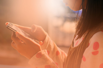 young girl with her smartphone