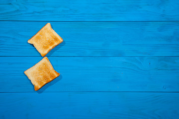 Toast on a wooden blue background