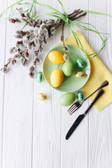 Easter concept. plate, fork, eggs on a white background