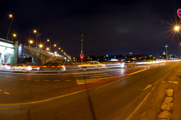 Fototapeta na wymiar Urban city road with car light trails at night 