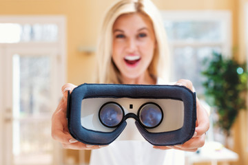 Young woman using virtual reality headset