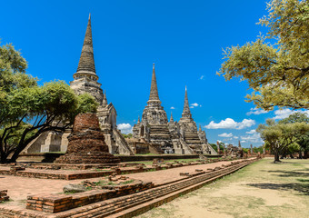 Fototapeta premium Ancient Pagoda in Wat Phrasisanpetch (Phra Si Sanphet). Ayutthaya historical city, Thailand