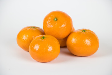 Small Pile of Fresh Ripe Clementines Isolated on White