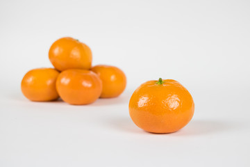Clementine Separated from Small Pile Isolated on White