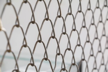 Steel wire mesh on rusty galvanized in Jail, Select focus with shallow depth of field.