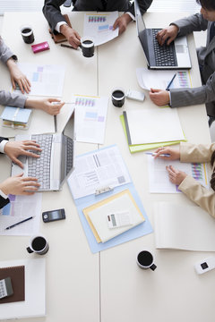 Overhead view of business people in business meeting
