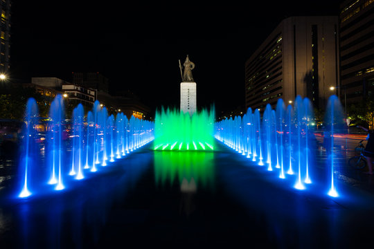King Sae Jong Dae Statue at Night with Colorful Water Fountain in Downtown Seoul, South Korea