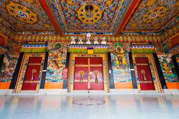 Fototapeta na wymiar Rumtek Monastery Entrance Doors with Colorful Ceiling in Sikkim, India