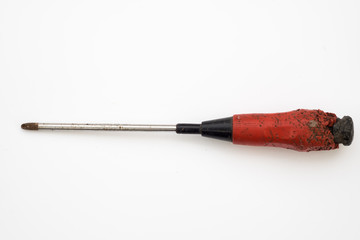 Old  red screw driver isolated white background
