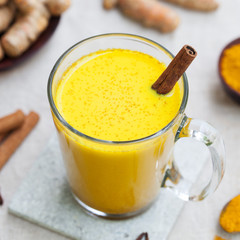 Turmeric drink, latte, tea, milk with cinnamon.