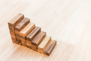 Wood block stacking as step stair. Business concept for growth success process.