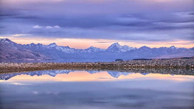 Snow Capped Mountains Reflected in still water timelapse