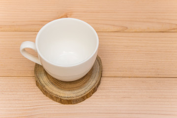 Fototapeta na wymiar coffee cup on the wood plate