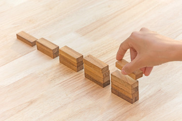 Wood block stacking as step stair. Business concept for growth success process.