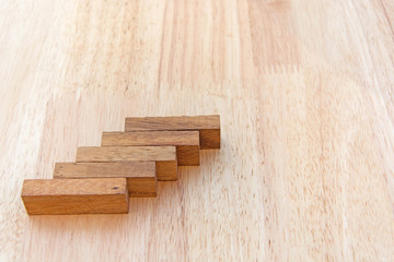 Wood block stacking as step stair. Business concept for growth success process.