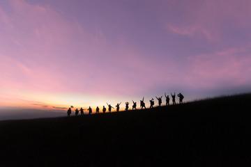 Silhouettes of my friendship who spent time on the mountain in the beautiful sky at the sunset. at Doi Monjong ,Thailand