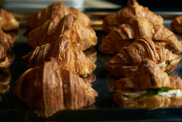 Close up of a Fresh croissant cheese sandwiches.