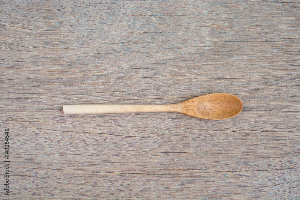 Wall mural wooden spoon on the table