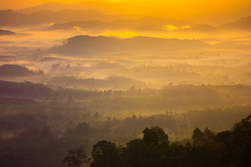 Beautiful sunrise in the morning over foggy tropical forest, on Viewpoint Phang Nga, Thailand