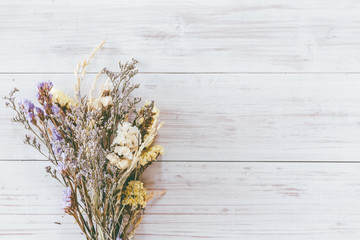 Dried flower on wooden background